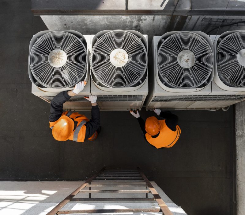 men-working-with-equipment-full-shot
